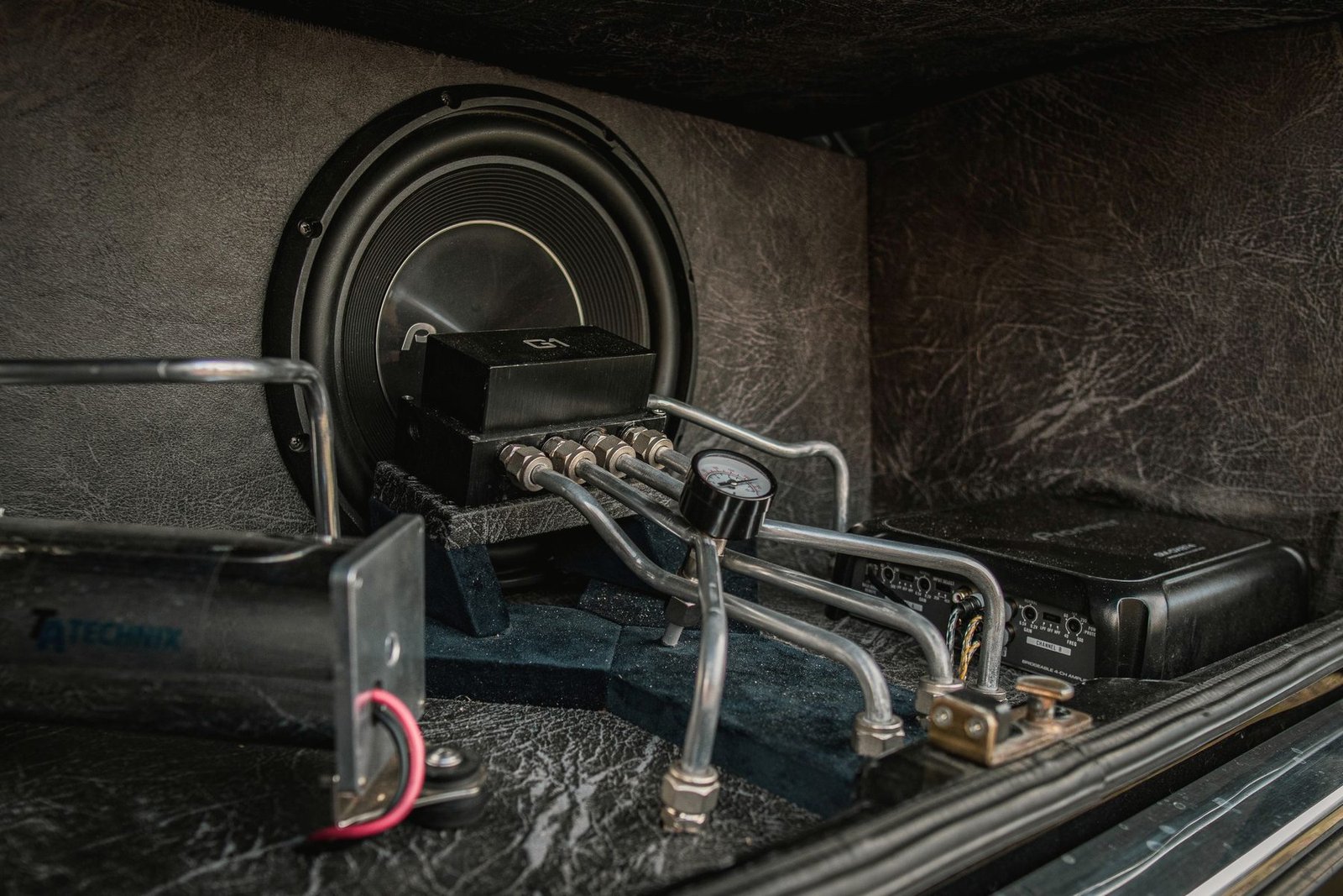 Polished metal pipework fitted into an engine bay.